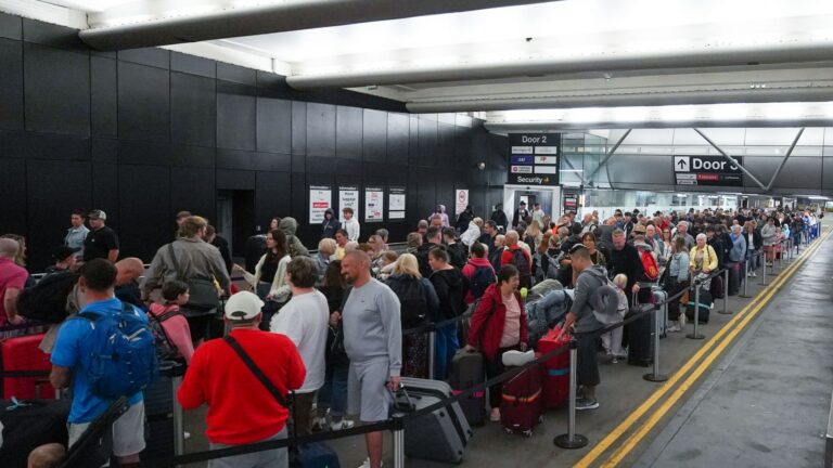 2023 manchester uk passengers queue 840921838.jpg