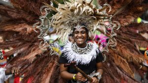 Feathered Fun: Notting Hill Carnival Dancers Sizzle Up the Streets! 🎉