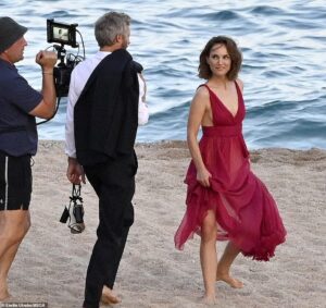 EXCLUSIVE: Natalie Portman looks stunning while modeling plunging red gown for dreamy Dior beach shoot in Spain… amid ‘marriage woes’