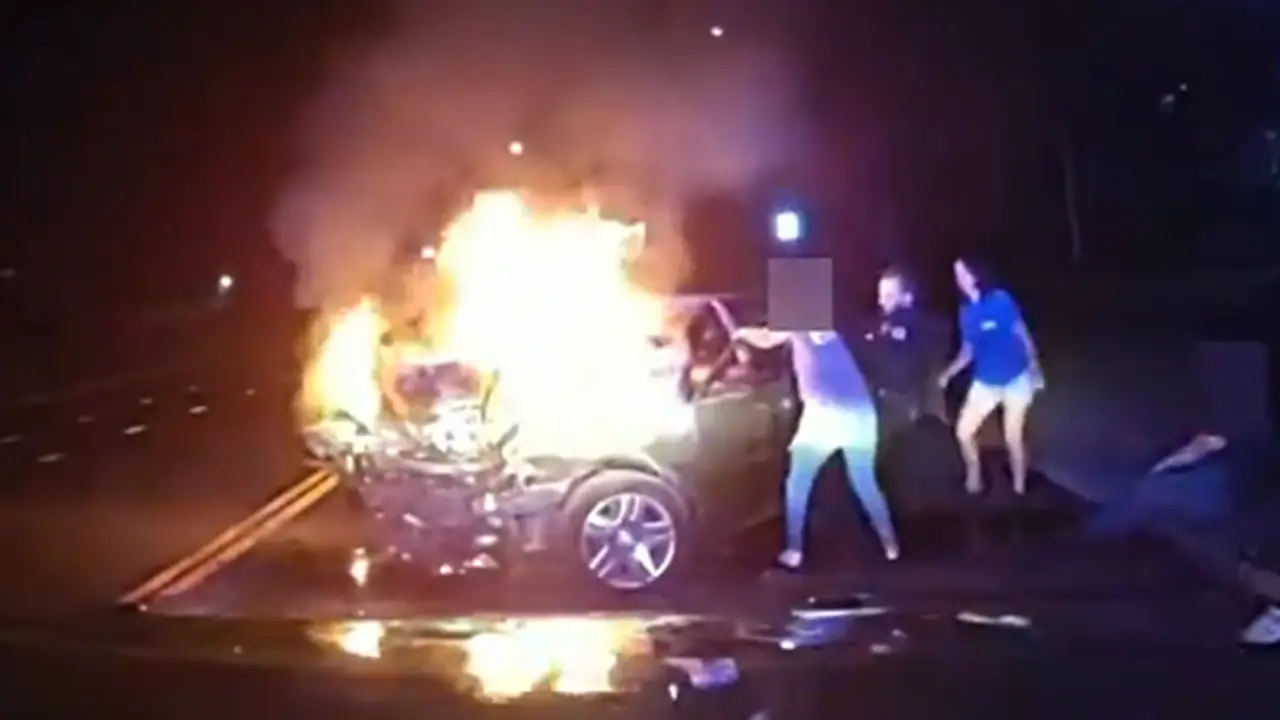 Dramatic video shows Colorado police officer helping save passenger from burning vehicle