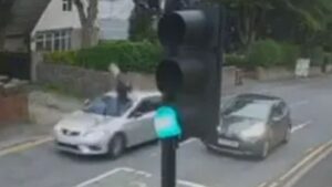 Cyclist Sent Airborne in Shocking Car Collision