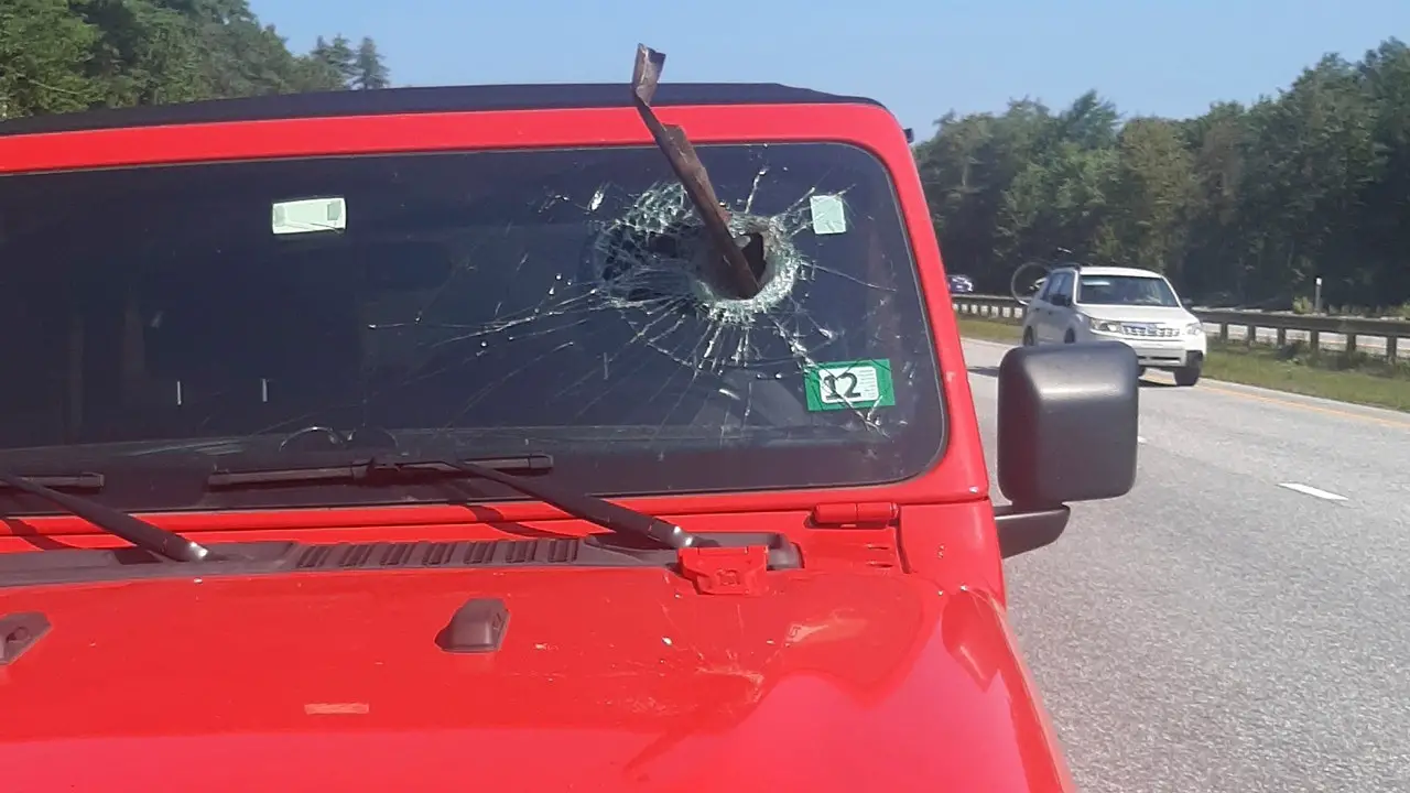 Metal debris breaks through windshield on Maine Turnpike, striking inches from driver’s face