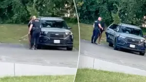 Cop’s steamy squad car session with woman in skimpy outfit caught on video