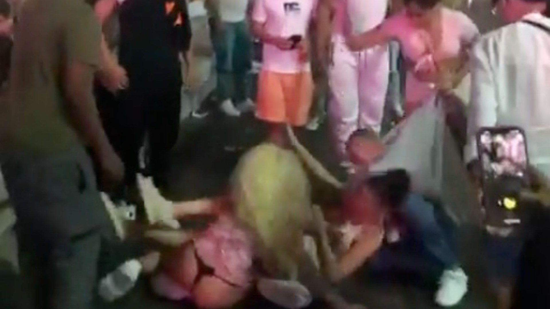 Shock moment half-naked women violently brawl outside McDonald’s as one is kneed three times forcing security to step in