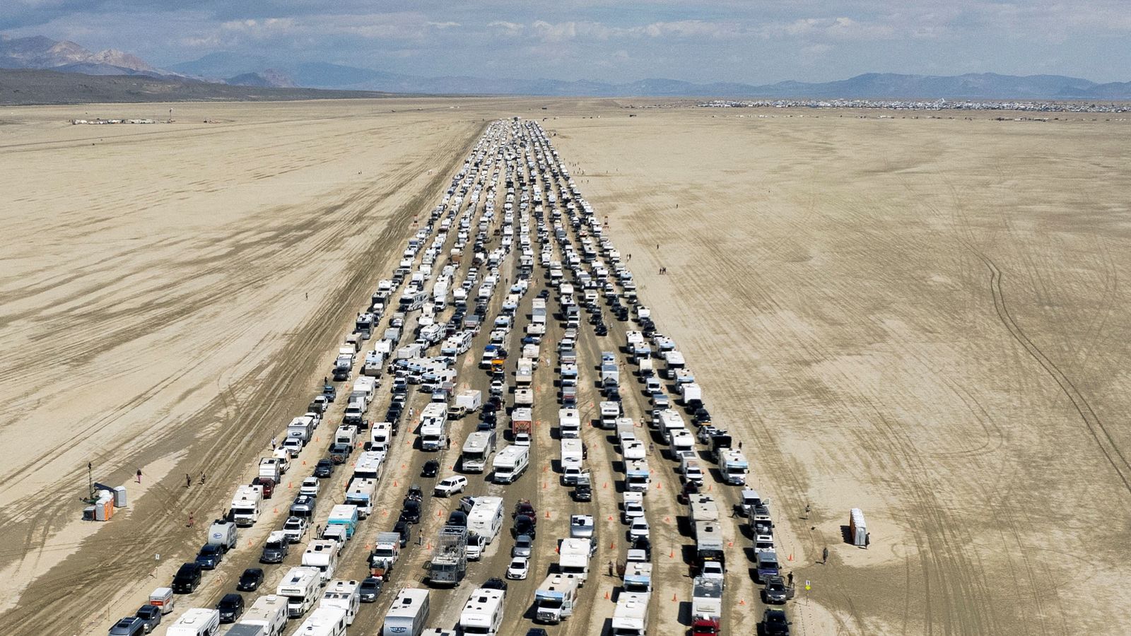Burning Man: Thousands of partygoers allowed to leave festival after flooding | US News