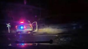 Former officer avoids jail after locking suspect in car that was hit by a train | US News