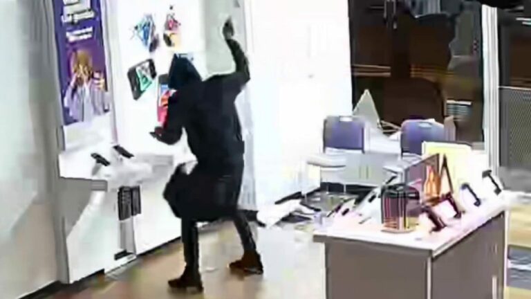 Maryland burglar caught on camera breaking into T Mobile store.jpg