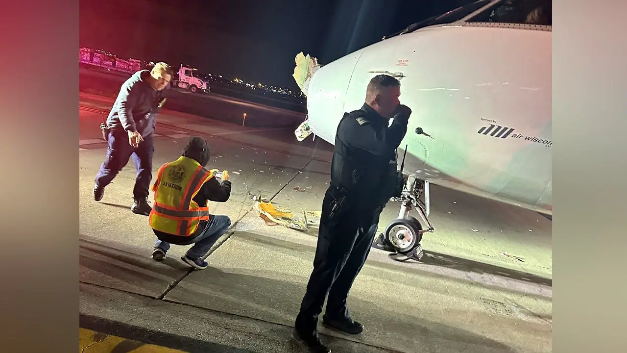 American Airlines regional plane collides with shuttle bus, injures two